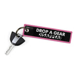 Drop A Gear And Disappear Keychain Key Tag - Pink